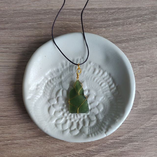 Forest green sea glass with gold wire wrap. $16