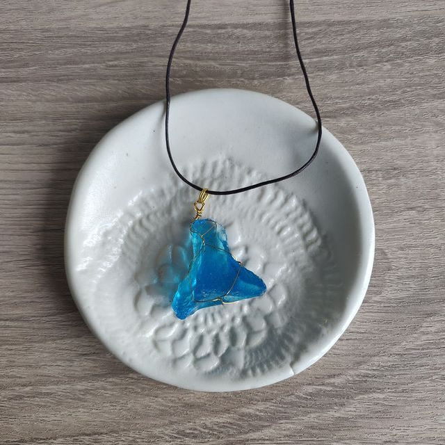 Super vibrant blue sea glass with gold wire wrap. $20. This is a super rare colour to find, I've only got one other pendant in the same colour x